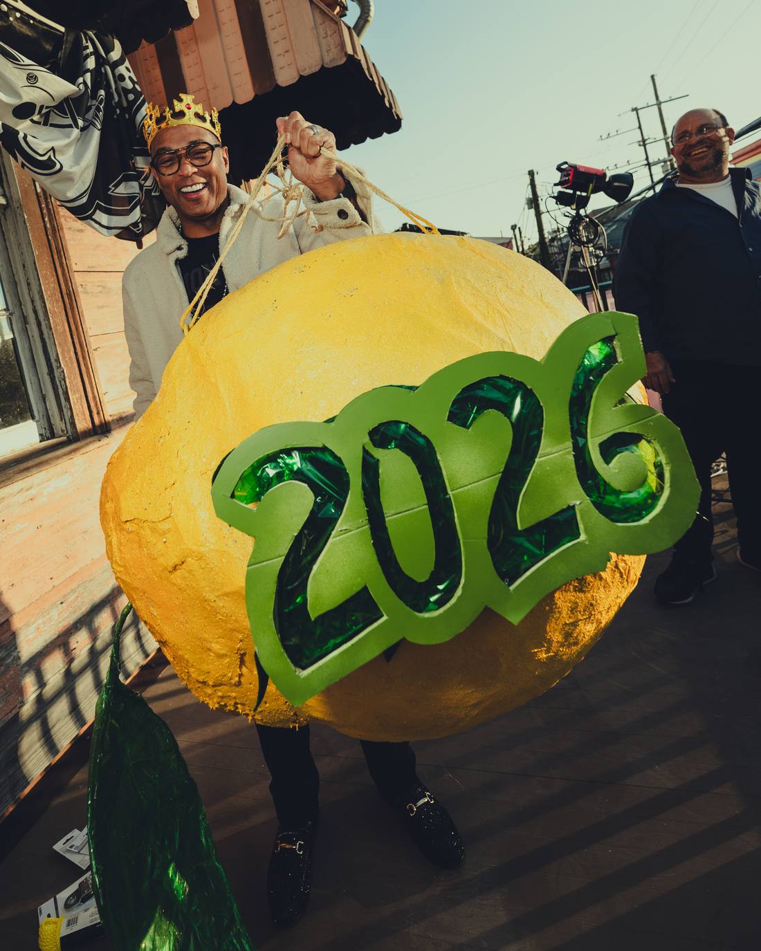 Don holding a giant lemon marked 2026
