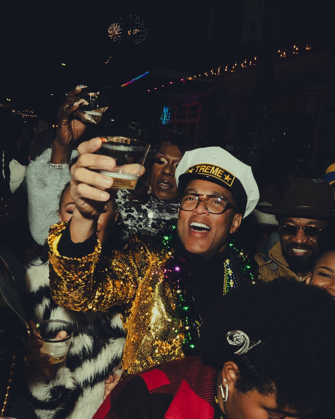 Don raising a toast in the crowd